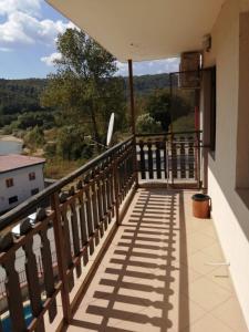 a balcony with a view of the water at Apartment Lake Tryavna in Tryavna