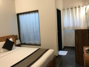 Rankk Stays客房内的一张或多张床位