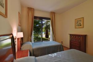 Postel nebo postele na pokoji v ubytování Minerva Resort Hotel