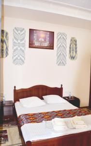 Ένα ή περισσότερα κρεβάτια σε δωμάτιο στο Elegant Family Hotel