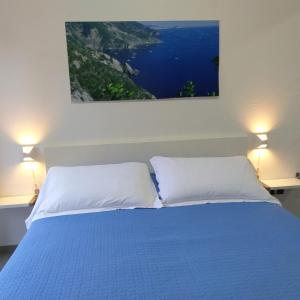 Un pat sau paturi într-o cameră la Il Patio