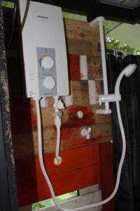 a nintendo wii game system with a white cord at hornbill river camp udawalwa in Udawalawe