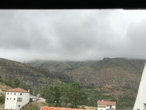 a view from a window of a mountain at Casa do Outeirinho in Sabugueiro