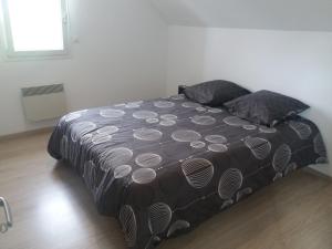 Postel nebo postele na pokoji v ubytování Le Fort des Sables
