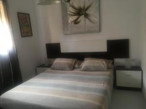 A bed or beds in a room at LasVistasApartment