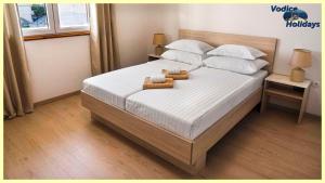 Postel nebo postele na pokoji v ubytování TayLa-Apartment Vodice