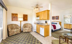 a hotel room with a bedroom and a bed at WorldMark Cathedral City in Cathedral City