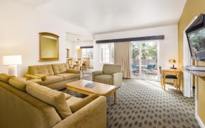 a living room with a couch and a table at WorldMark Cathedral City in Cathedral City