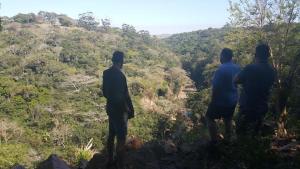 a group of three men standing on top of a hill at IRONWOOD LODGE in Pennington