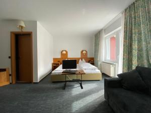 Postel nebo postele na pokoji v ubytování Hotel Herbstein