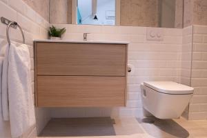 a bathroom with a sink and a toilet at BeSalamanca in Salamanca