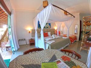 Un pat sau paturi într-o cameră la Xamã Senses - Hotel Pousada