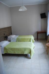 Katil atau katil-katil dalam bilik di Albergo della Posta