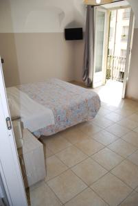 Postel nebo postele na pokoji v ubytování Albergo della Posta + 2 fotografie