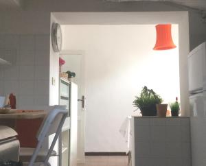 A kitchen or kitchenette at CASA DI BIANCA ATTICO PANORAMICO A CHIETI CENTRO