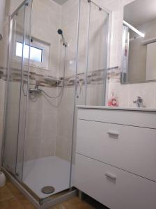 a bathroom with a shower and a sink at Casa Vaz 2 in Grândola