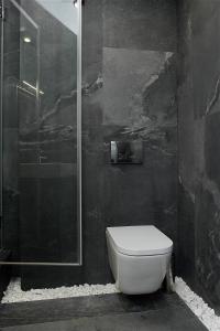a bathroom with a toilet and a shower at Найгарніша квартира в Черкасах! in Cherkasy +14 photos