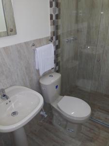 a bathroom with a toilet and a sink and a shower at Hotel Boutique Street 50 in Medellín +52 photos