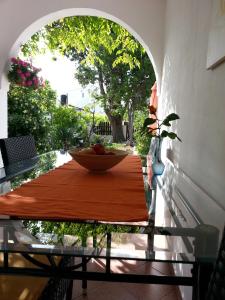 a table with a bowl of fruit on top of it at Apartments Kiara Sabunike 836 in Privlaka +54 photos