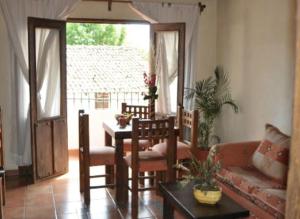 a living room with a couch and a table at Meson Luna Sacra in Tapalpa