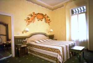Postel nebo postele na pokoji v ubytování Hotel Alla Riviera + 37 fotografií