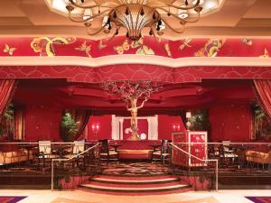 
a large red and white decorated room with a red ceiling at Encore at Wynn Las Vegas in Las Vegas
