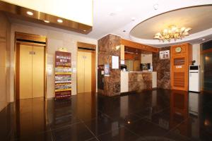 a lobby of a building with a lobby at Amour Hotel in Suwon