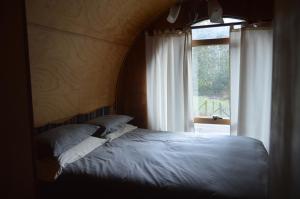 Giường trong phòng chung tại Refugios Canto del Agua