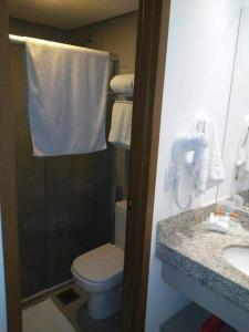 Un baño de Apartamento em Olímpia em frente ao Thermas