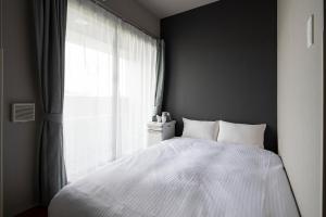 Postel nebo postele na pokoji v ubytování Grids Tokyo Ueno Hotel&Hostel