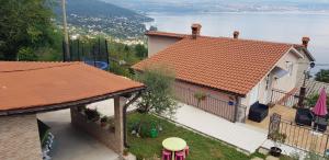 an image of a house with a view of the water at House Anastazia Pool & Panoramic Sea View in Lovran +33 photos