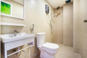 a bathroom with a toilet and a sink and a shower at OYO 89387 Sun Keerana Hotel in Klang