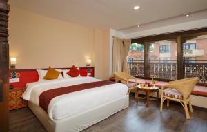 Postel nebo postele na pokoji v ubytování Hotel Manaslu