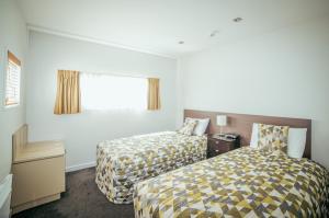 Postel nebo postele na pokoji v ubytování Airport Delta Motel