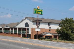a sign for a hotel on the side of a road at Economy Inn - Statesville in Statesville +9 photos