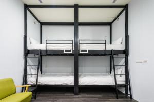 Postel nebo postele na pokoji v ubytování Place‧X Hotel