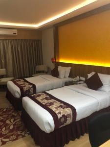 Voodi või voodid majutusasutuse Hotel Harrison Palace toas