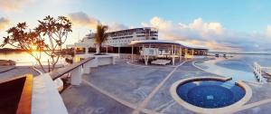 a cruise ship in the water with a pool at Doulos Phos The Ship Hotel in Lagoi