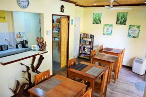 a dining room with wooden tables and chairs at Angel Nido Resort in El Nido