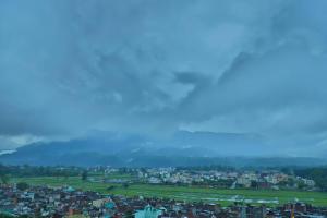 a view of a city with mountains in the background at The Most Beautiful Property Of Rishikesh in Rishīkesh