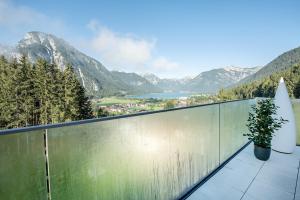 a balcony with a view of a valley and mountains at Naturhotel Alpenblick in Maurach