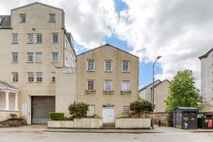 an apartment building in a city with two buildings at Central Bright 3 Bed Flat with Pool & Parking in Edinburgh