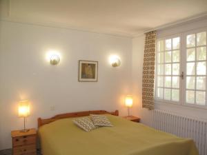 Postel nebo postele na pokoji v ubytování Résidence Miro, gîtes climatisés avec piscine et tennis