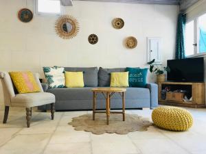 Posezení v ubytování La capucinette à l’ombre du marronnier