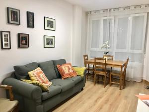 a living room with a couch and a table at My Space en el centro in Logroño