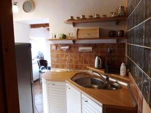 a kitchen with a sink and a counter top at Privát Liptov Holiday House in Liptovský Mikuláš