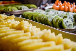 a buffet of pickles and cucumbers in trays at Volcanic Charming House in Ribeira Grande