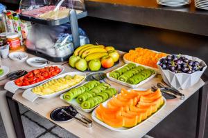 a table with different fruits and vegetables on it at Volcanic Charming House in Ribeira Grande