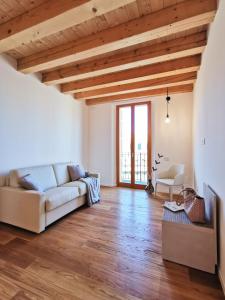 a living room filled with furniture and a window at Locanda del Delta in Comacchio