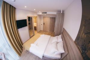 TV a/nebo společenská místnost v ubytování Hotel Verso